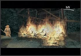 Podnieś dzidę wbitą koło ogniska i podpal ją na nim - [Solucja] Necropolis cz.1 | Peter Jacksons King Kong - Peter Jacksons King Kong - poradnik do gry