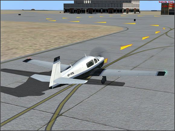 Strzałki włączane przez Progressive Taxi pomagają kołować. - Microsoft Flight Simulator X: Parkowanie | Mooney Bravo - Microsoft Flight Simulator X - poradnik do gry