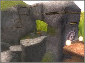 Po otwarciu kraty wskocz skalnymi schodami na górę, w okolicę pomarańczowego guzika - [ETAP VIII] Lost in the Seven Lands - I cz.4 | Artur i Minimki - Artur i Minimki - poradnik do gry