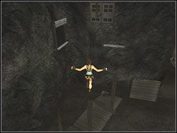 Omiń ciężar na linie i tuż za nim przeskocz na wierzchołek wystającego z ziemi słupa - Poziom 13. Kopalnie Natli (1) | Sekrety w Tomb Raider Anniversary - Tomb Raider: Anniversary - poradnik do gry