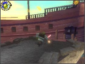 Udaj się w lewo, zejdź po schodach w dół i przeskocz na skałę z lewej, gdzie znajdziesz ostatni kubek [1] - [Solucja] Etap 2 - Doki | Shrek Trzeci - Shrek Trzeci - poradnik do gry