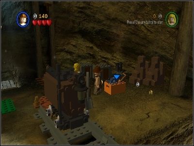 Wskocz Willie na półkę skalną przy kolorowych światełkach i z leżących tu klocków zbuduj drabinkę dla Indiego - Chapter 4 - Free the Slaves (cz.1) - Świątynia Zagłady - LEGO Indiana Jones: The Original Adventures - poradnik do gry