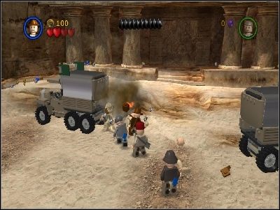 Pokonaj przeciwników i szybko zniszcz drewniane belki podtrzymujące naczepy od dwu ciężarówek - Chapter 6 - Temple of the Grail (cz.1) - Ostatnia Krucjata - LEGO Indiana Jones: The Original Adventures - poradnik do gry