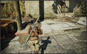 Przebiegnij na drugą stronę ulicy [1] i podnieś karabin [2] leżący na chodniku przed budynkiem - Rozdział 2 - Dzięki Bogu (cz.1) | Opis przejścia | Terminator Ocalenie - Terminator: Ocalenie - poradnik do gry