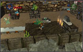 Rozpraw się z wrogami, przekręć zawór w narożniku [1] , podnieś butelkę ze skrzyni i przy jej pomocy zgaś ogień na środkowej platformie [2] - Jaskiniowi harcownicy (bonus) | Kryształowa Czaszka Akt III - LEGO Indiana Jones 2: The Adventure Continues - poradnik do gry