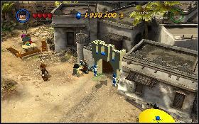 W pustynnej części mapy skieruj się Marion do skały z prawej [1] i wskocz na nią - Rzeź na rynku | Poszukiwacze Zaginionej Arki | LEGO Indiana Jones 2 - LEGO Indiana Jones 2: The Adventure Continues - poradnik do gry