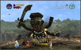 Następnie zmień postać na Shortyego, szybko podbiegnij do prawej nogi i wciśnij przycisk akcji, co spowoduje, że bohater wjedzie do środka ogromnej postaci - Szaleństwo Moli | Świątynia Zagłady | LEGO Indiana Jones 2 - LEGO Indiana Jones 2: The Adventure Continues - poradnik do gry