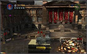 Przy pomocy łopaty odkop jeepa [1] , rozpędź się i z platformy z prawe wybij się tak, aby wylądować na kolumnie z lewej [2] , wprost na dużym przycisku - Niebezpieczne parkowanie (bonus) | Ostatnia Krucjata | LEGO Indiana Jones 2 - LEGO Indiana Jones 2: The Adventure Continues - poradnik do gry